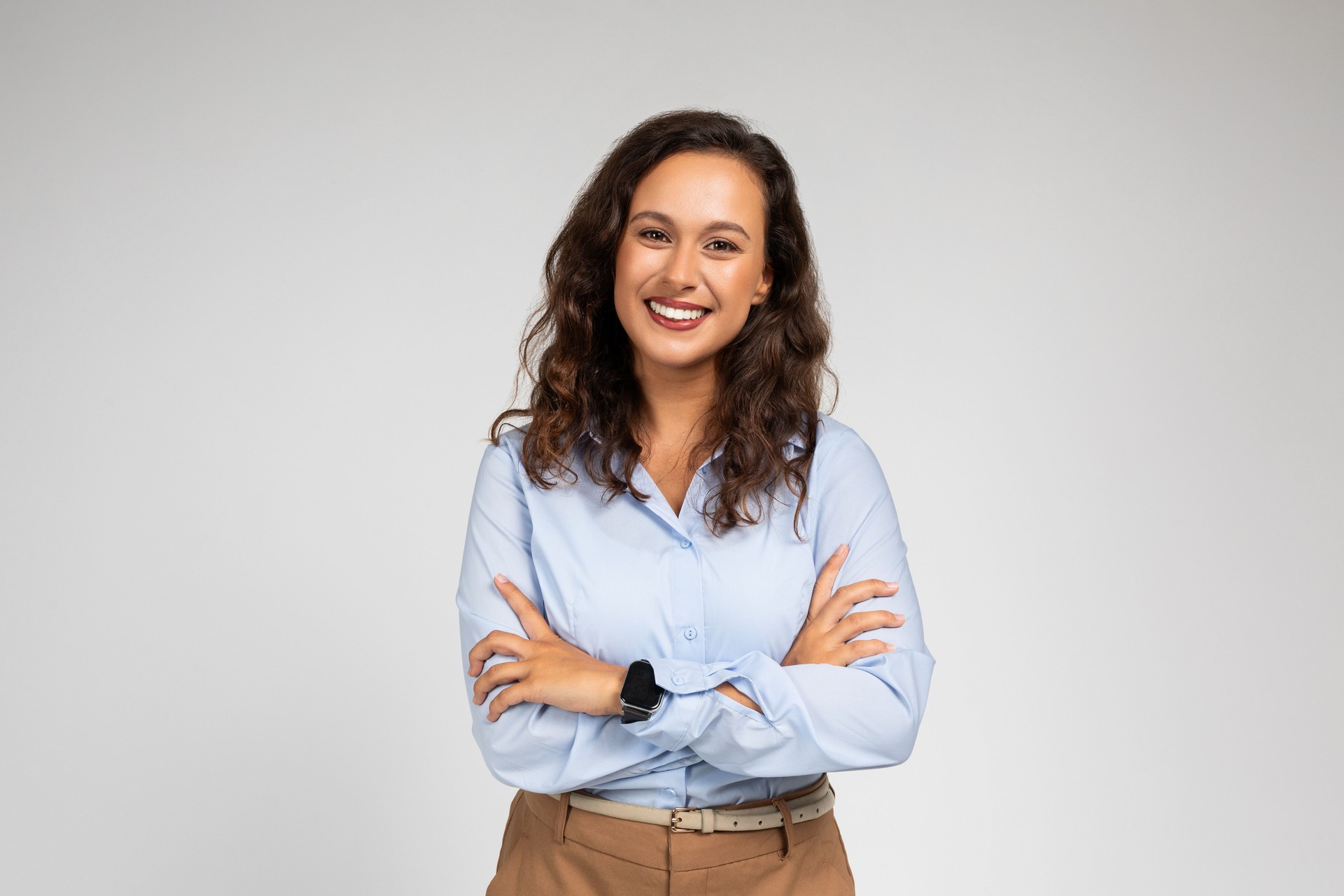 Smiling friendly confident millennial caucasian lady manager, teacher in formal wear with crossed arms